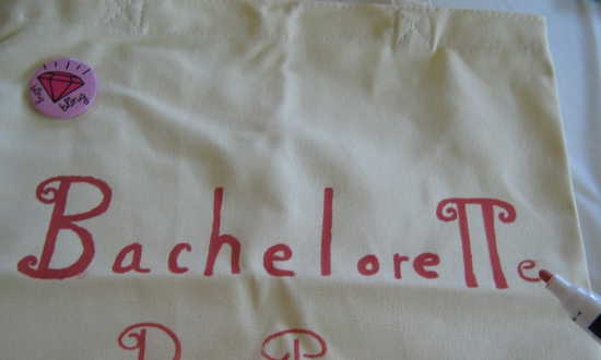 Writing "Bachelorette Party" on the tote bag